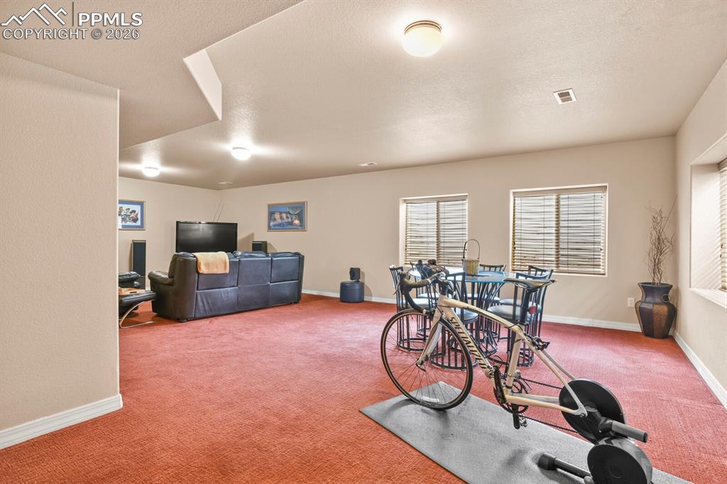Image 32 of 42: Another view of the Family Room in the basement.