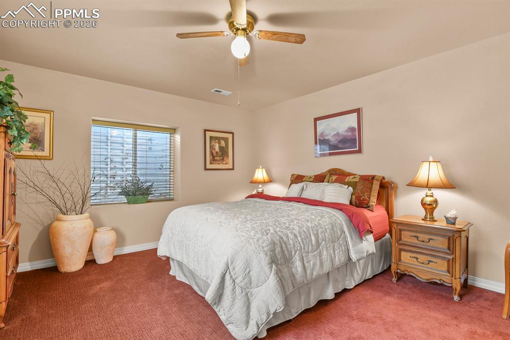 Image 34 of 42:  4th Bedroom in the basement, featuring a ceiling fan and carpet floors
