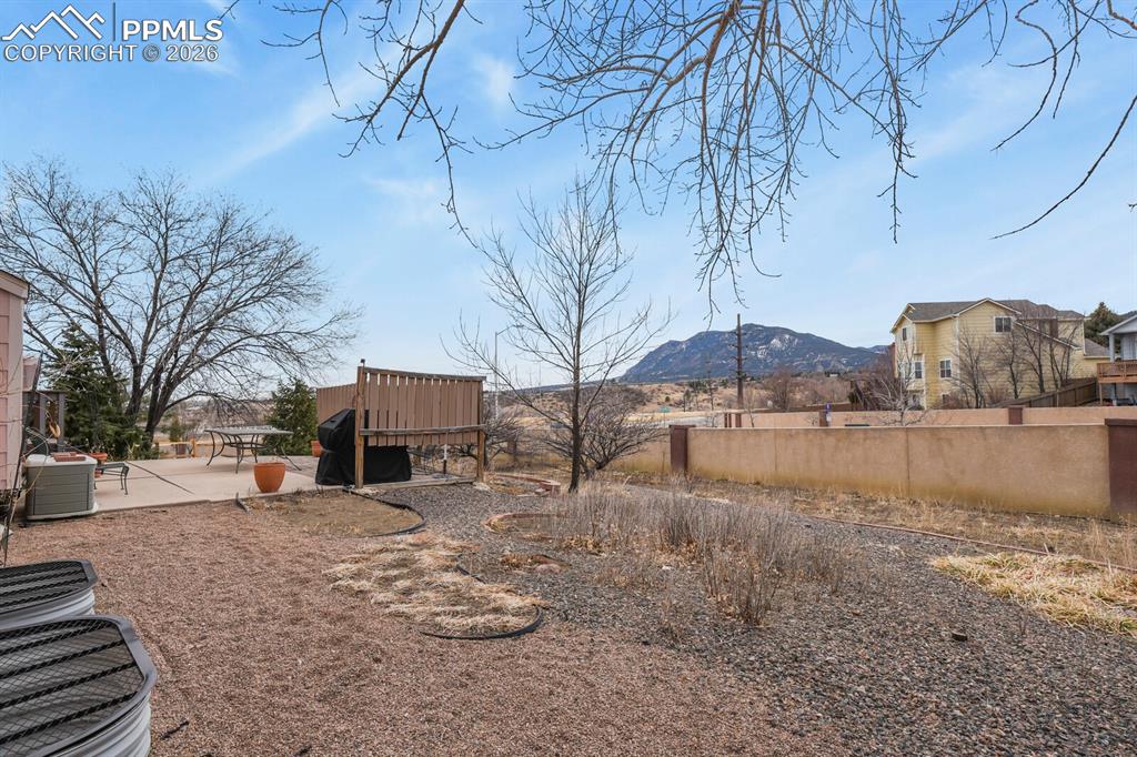 Image 39 of 42: View of yard with a mountain view