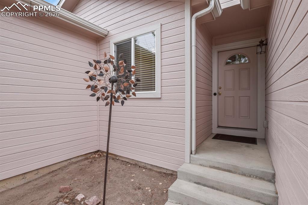 Image 4 of 42: Convenient covered entry to the front door.