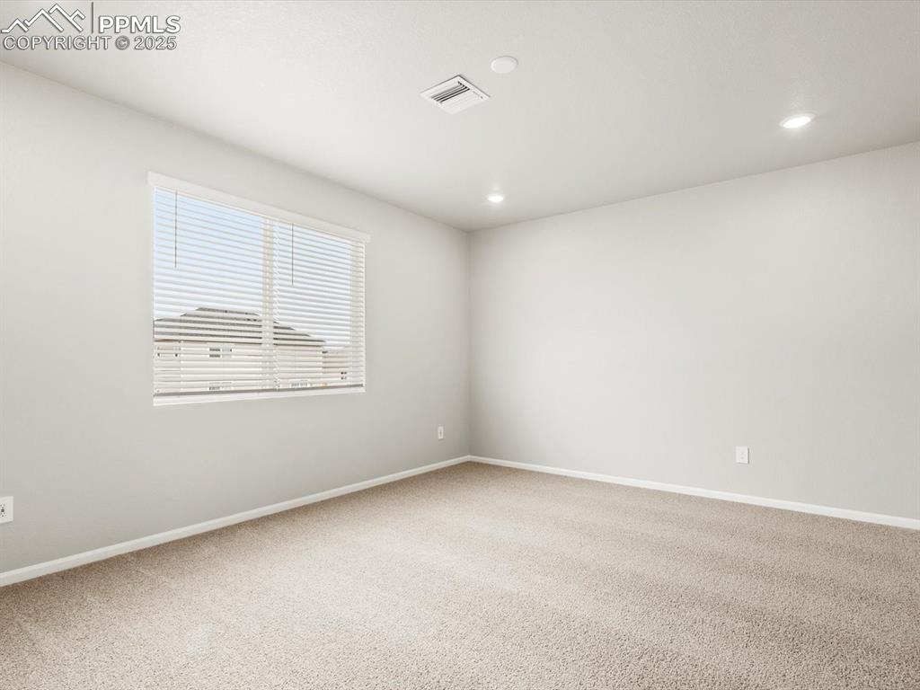 Image 10 of 26: Spare room featuring carpet flooring and recessed lighting