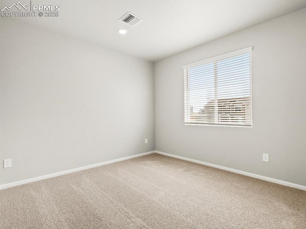 Image 12 of 26: Unfurnished room with carpet floors and recessed lighting