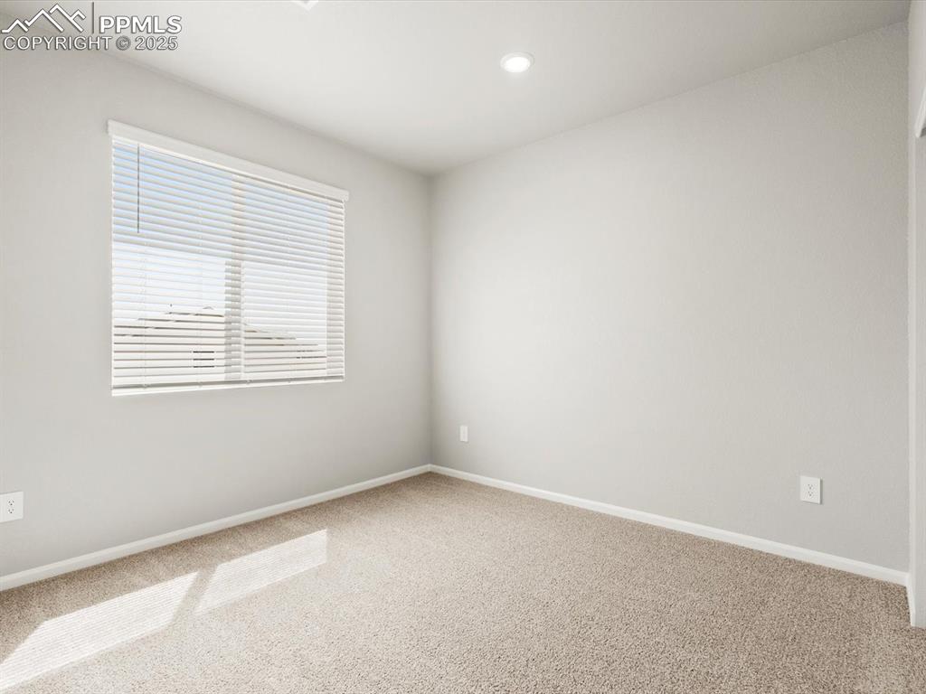 Image 13 of 26: Empty room featuring carpet floors and recessed lighting