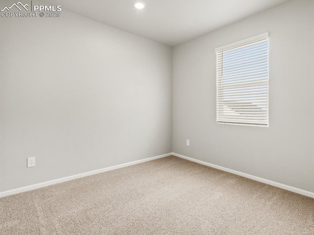 Image 14 of 26: Spare room featuring carpet floors and recessed lighting