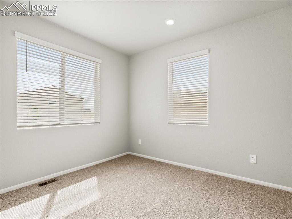 Image 15 of 26: Empty room featuring carpet floors and recessed lighting