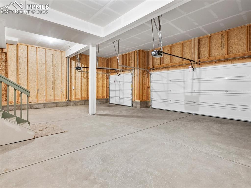 Image 26 of 26: Garage with a garage door opener