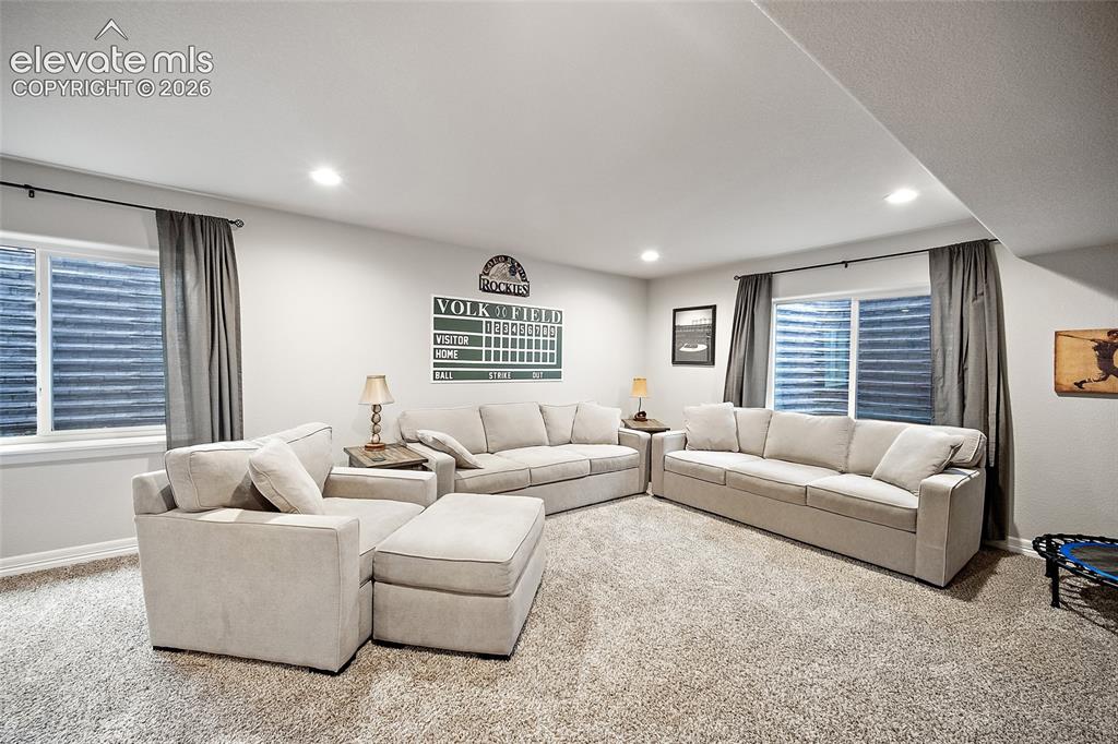 Image 21 of 49: Spacious carpeted room featuring recessed lighting, a white painted ceiling