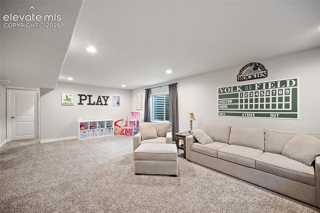 Image 23 of 49: Spacious finished lower level with recessed lighting