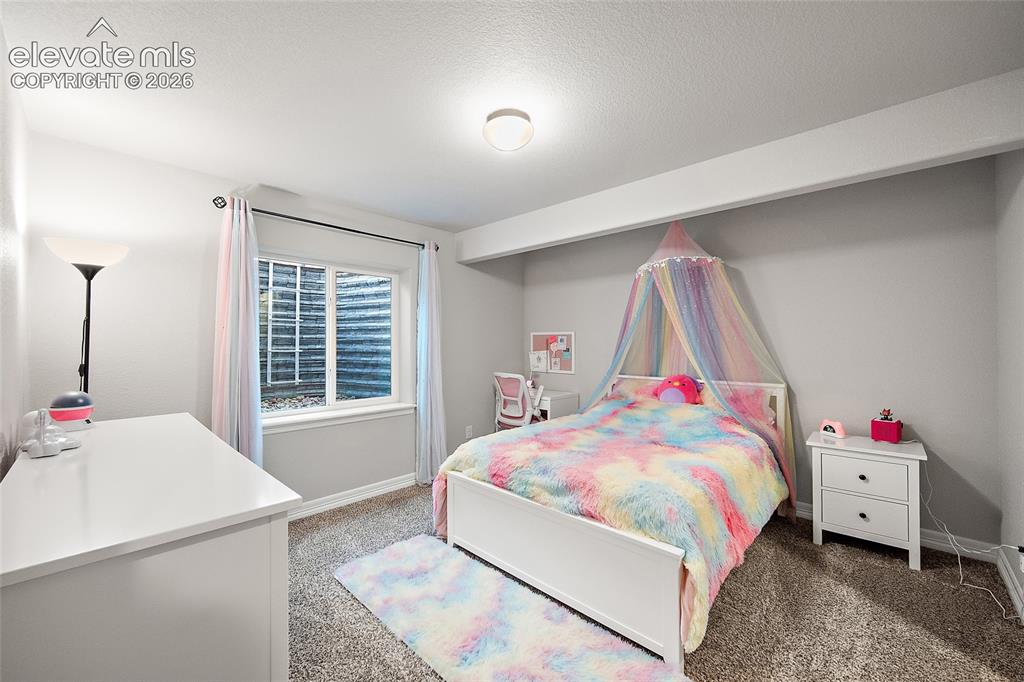 Image 25 of 49: Carpeted room featuring a white window frame, recessed ceiling light, and l