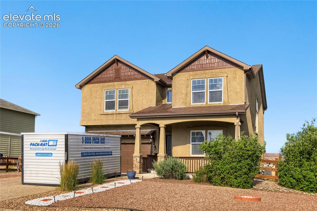 Image 1 of 32: Two-story stucco exterior with gabled roof lines and contrasting shake sidi