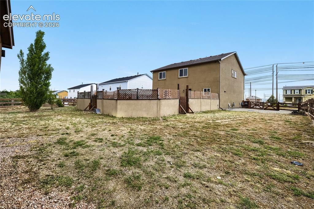 Image 31 of 32: Situated on a 12,995sqft lot this home provides plenty of parking for an RV
