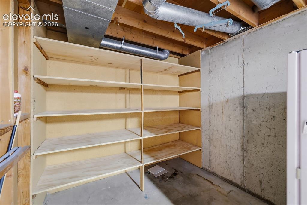 Image 24 of 43: Storage room with shelves
