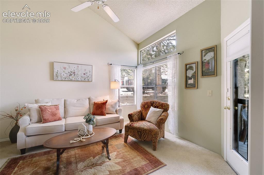 Image 17 of 27: Living Room with door leading out to the composite deck.
