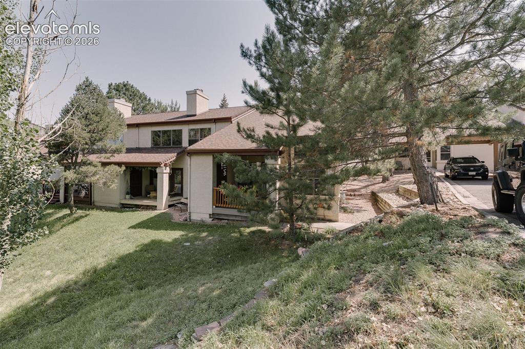 Image 21 of 27: Surrounded by towering pines and backing to serene open space.