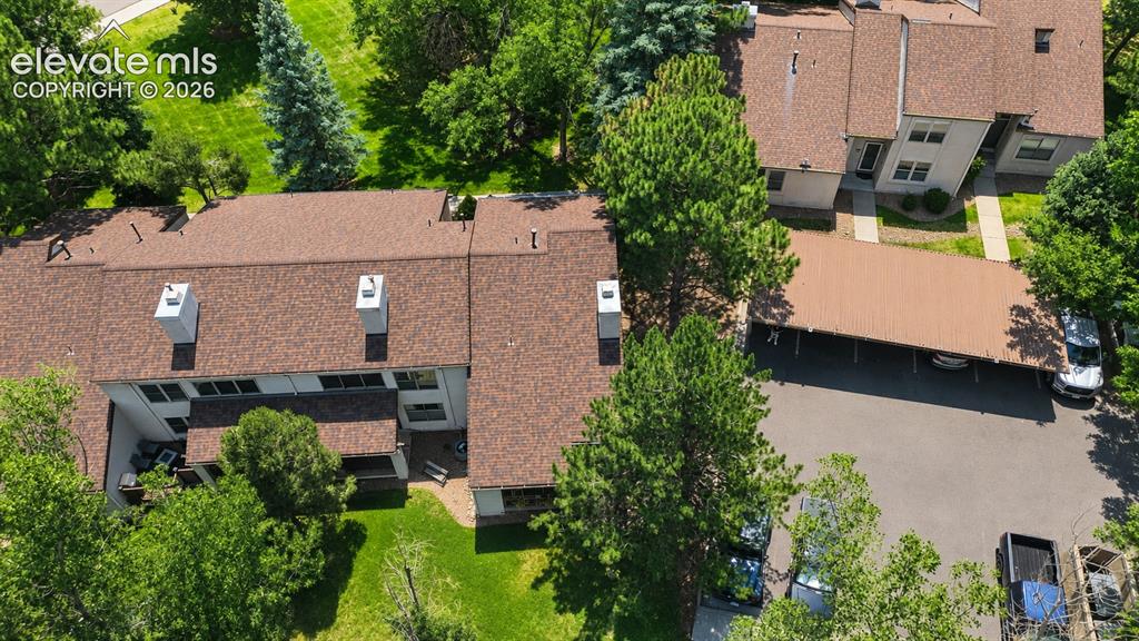 Image 25 of 27: Aerial view of complex and carports.