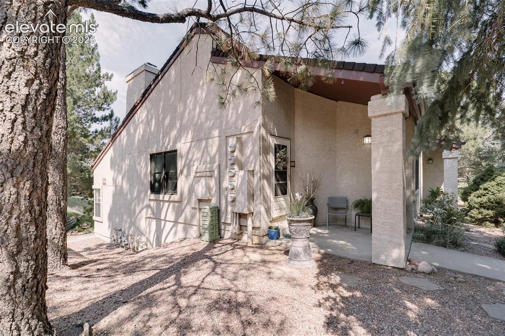 Image 3 of 27: Side view of the welcoming covered front porch.