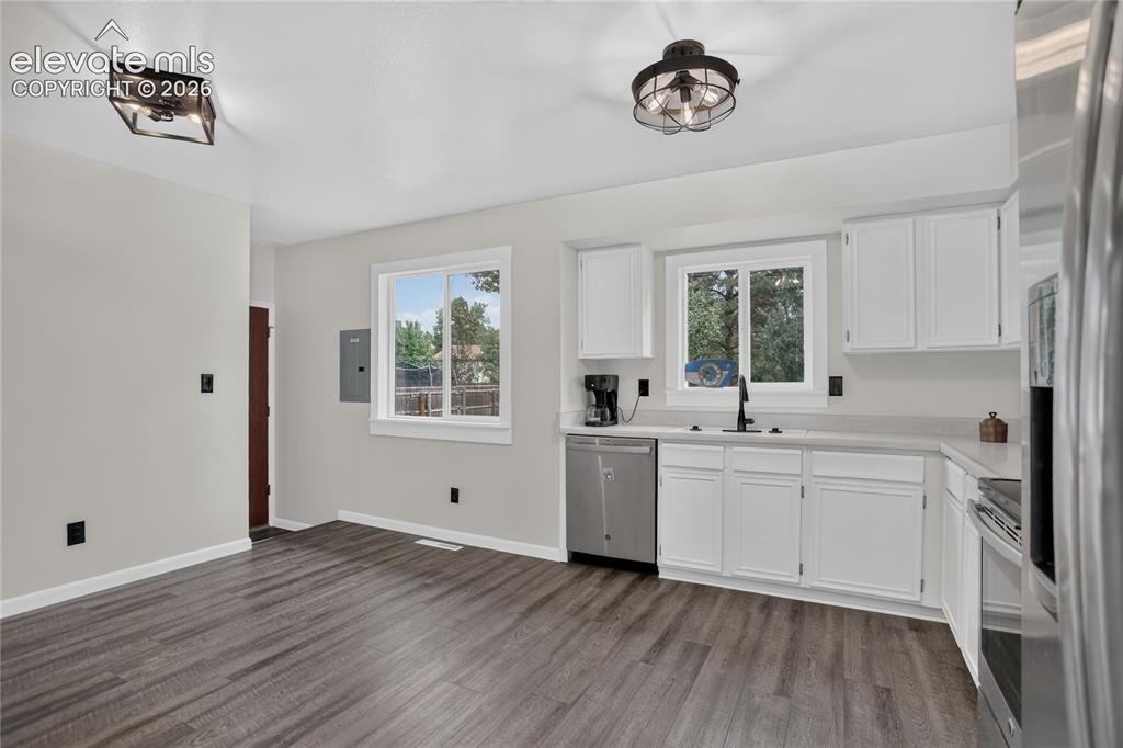 Image 8 of 26: Kitchen with walk-out to backyard