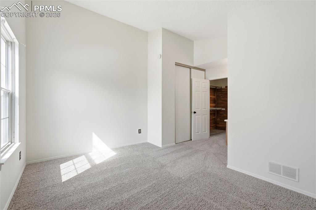 Image 19 of 44: Spare room featuring light colored carpet and baseboards