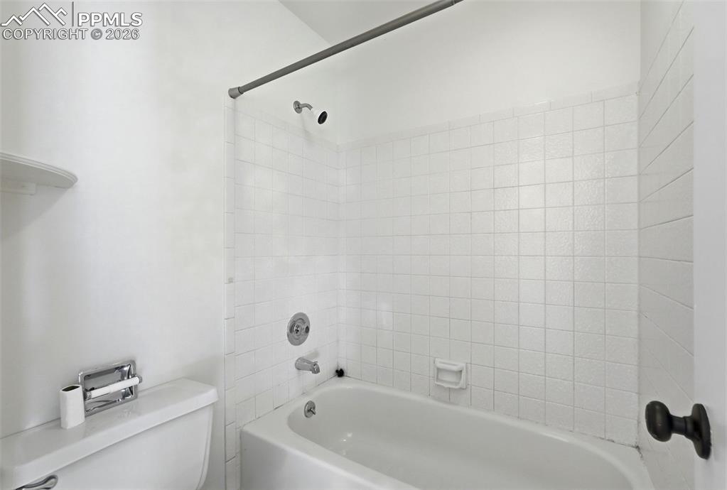 Image 22 of 44: Full bath featuring toilet and bathtub / shower combination