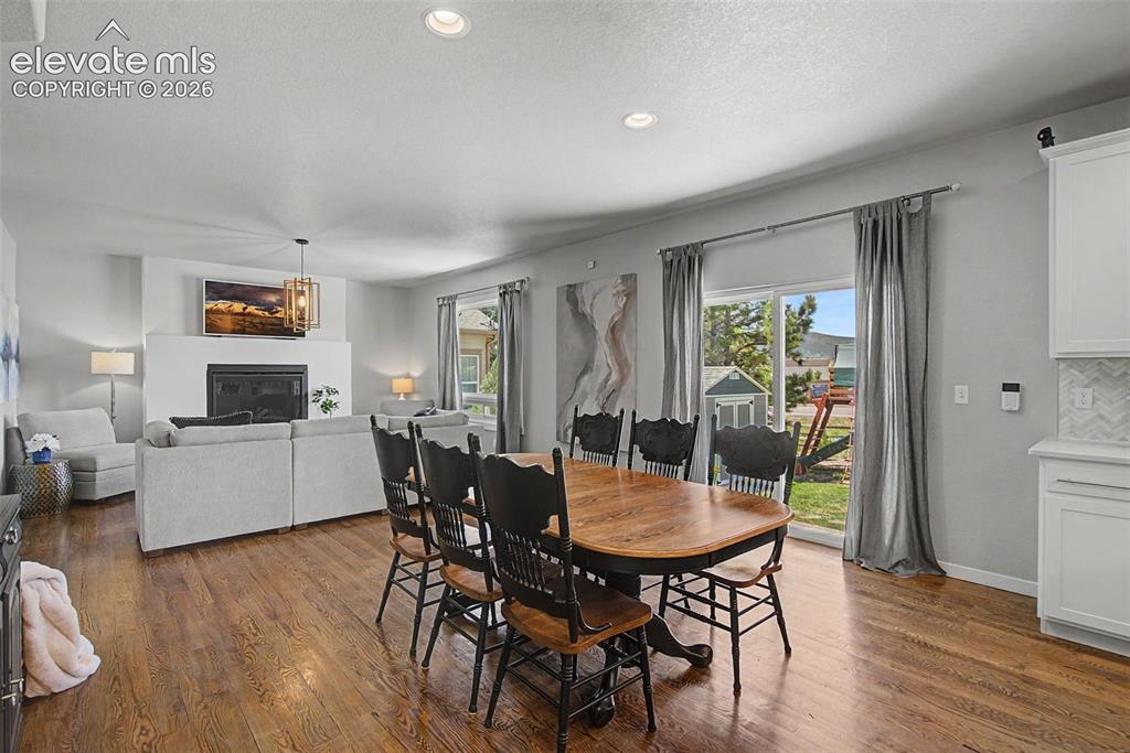 Image 16 of 40: Spacious dining with access to back patio. 