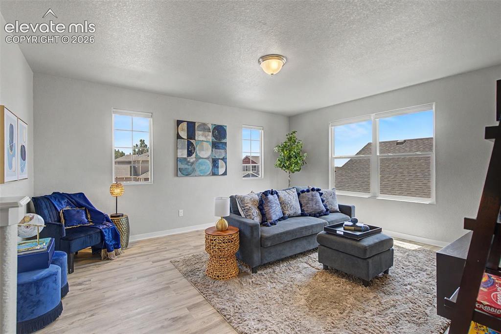 Image 24 of 40: Spacious, light and bright... with easy blinds for movie night. This genero