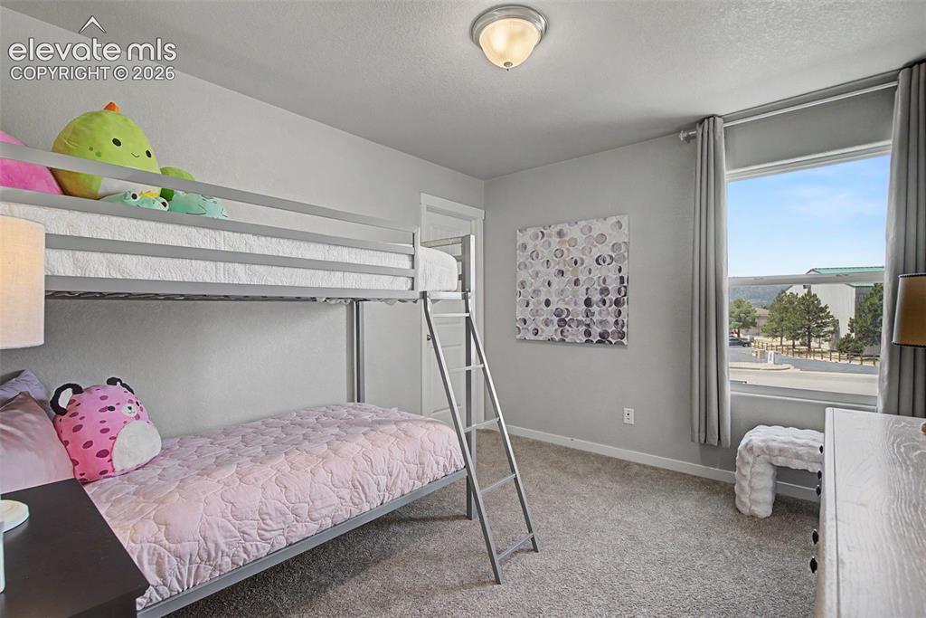 Image 27 of 40: This charming room features a generous closet-- and sunsets that will inspi