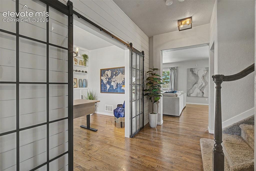 Image 3 of 40: Sweet entry. Perfect home office or flex room.