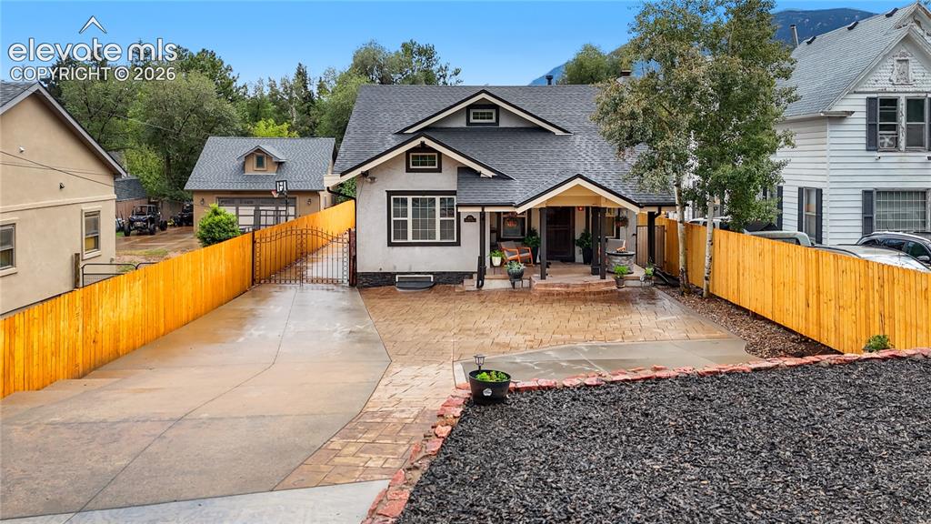 Image 12 of 45: Charming Craftsman-style home featuring a spacious backyard with profession