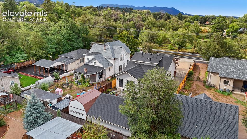 Image 14 of 45: Aerial view showcasing multiple residential properties with varied architec
