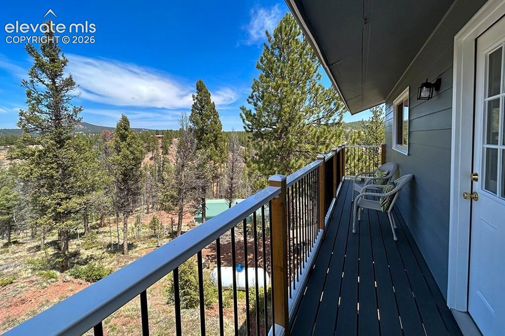Image 21 of 32: Private balcony off of the primary bedroom