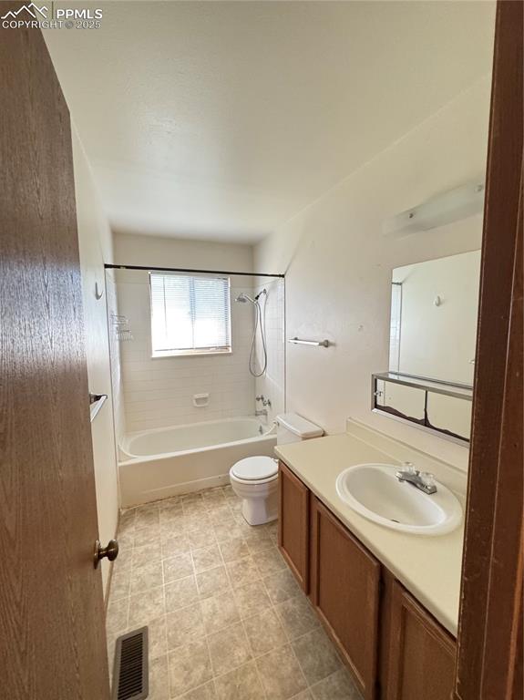 Image 10 of 11: Full bathroom featuring shower / bath combination and vanity