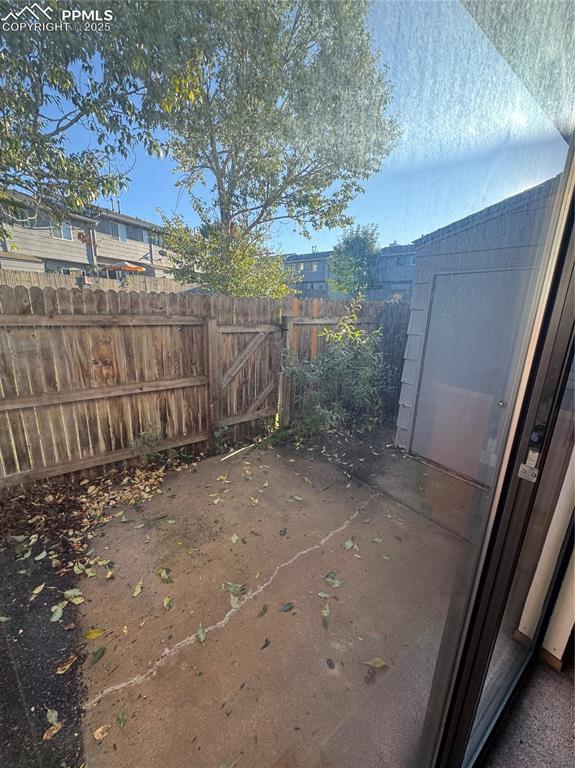 Image 11 of 11: View of fenced backyard