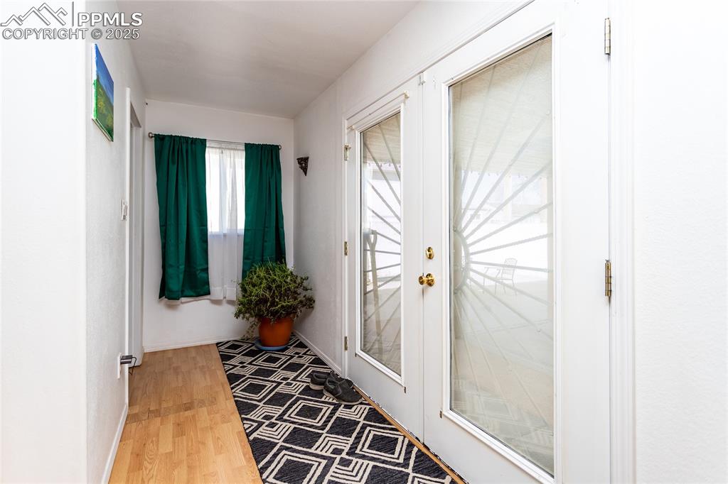 Image 18 of 34: French doors to backyard