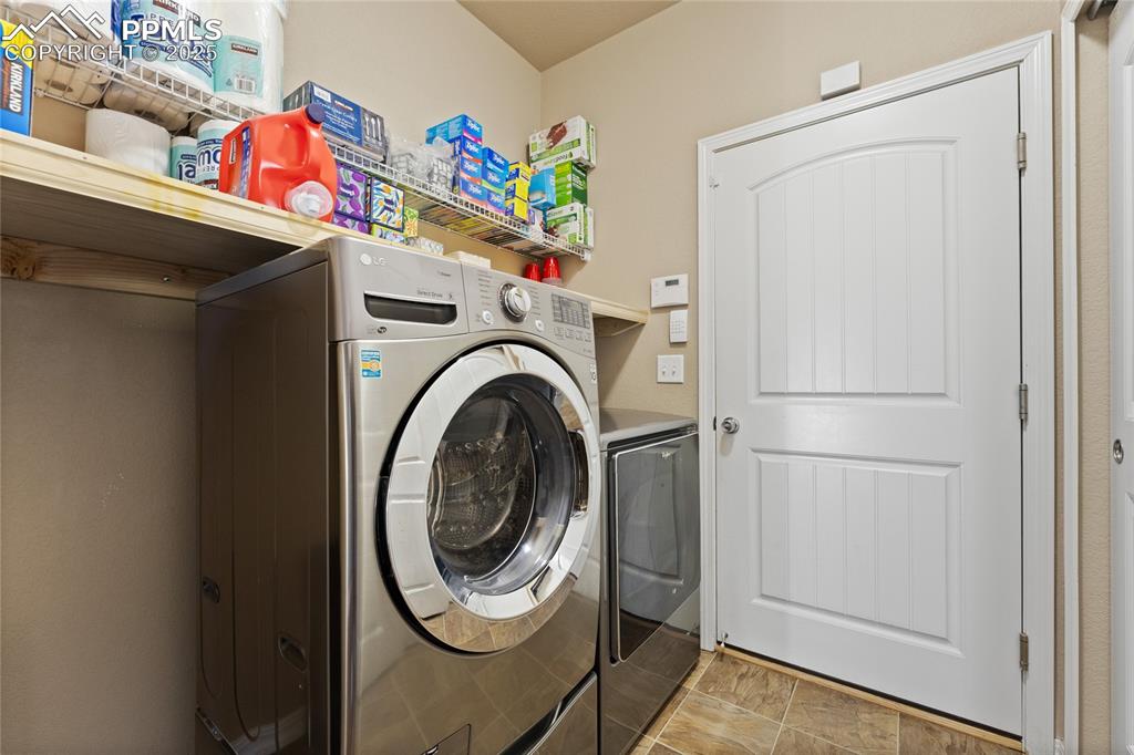 Image 21 of 41: Large Laundry Space with Garage Access