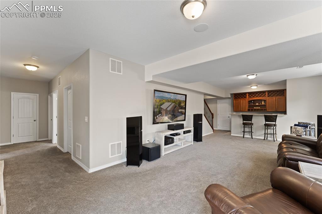 Image 28 of 41: Have all your friends over and entertain them at the Wet Bar. Room wired fo