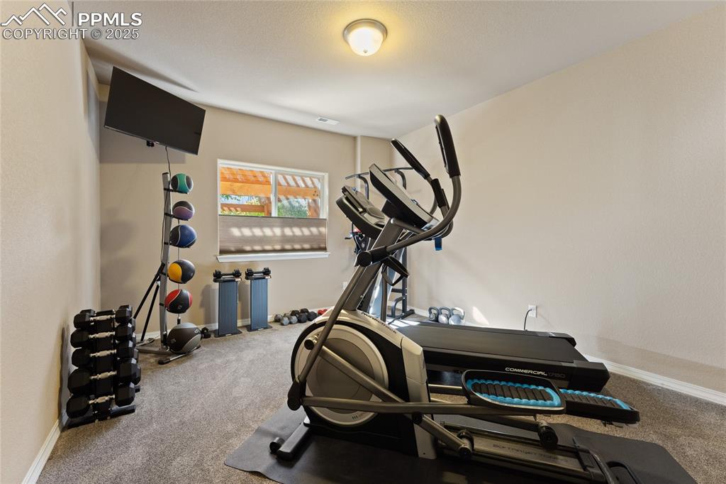 Image 35 of 41: Downstairs Bedroom used as a fitness area