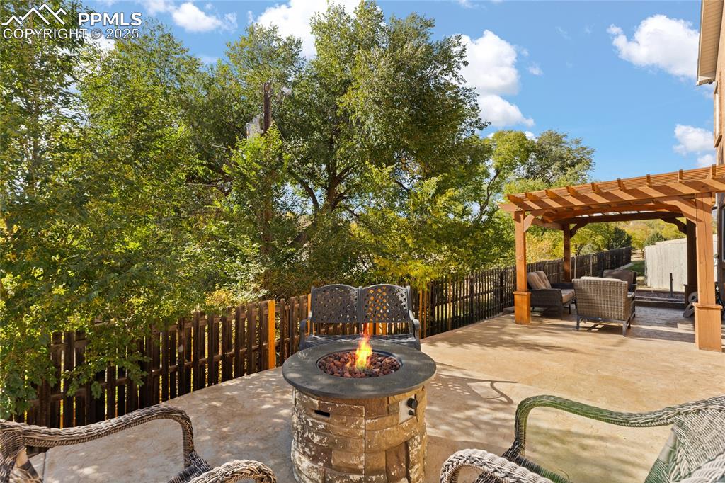 Image 38 of 41: Large Stamped Concrete Patio. Enjoy Amazing days in the Sun and Watch the S