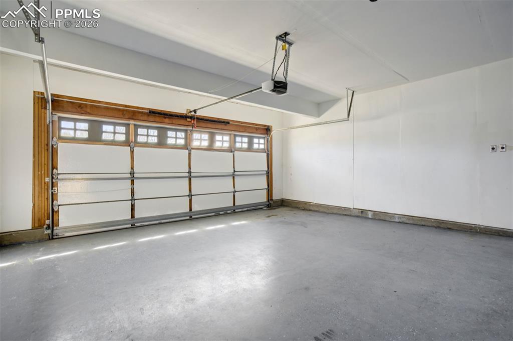 Image 44 of 50: Finished Garage - Epoxy Coated Floor