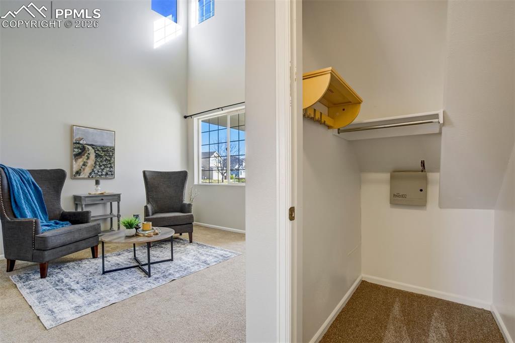 Image 7 of 50: Formal Living Room and View of Closet