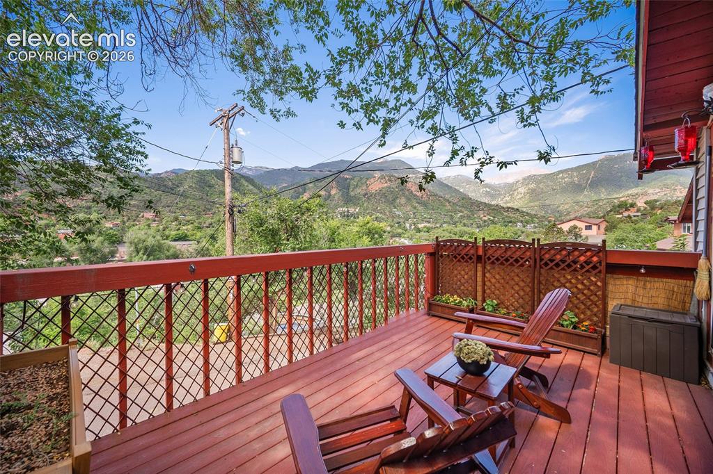 Image 2 of 31: Spectacular elevated deck offering sweeping panoramic views of Pikes Peak a