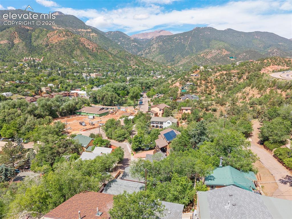 Image 26 of 31: Spectacular elevated view capturing sweeping mountain vistas, including Pik
