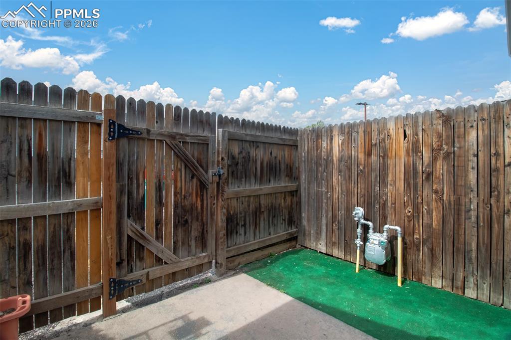 Image 13 of 20: Privacy fenced patio area