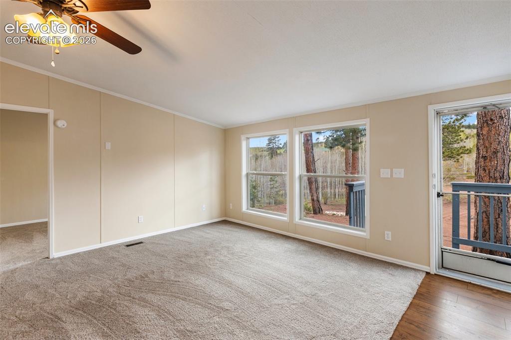 Image 13 of 48: Living room area/entry on the R