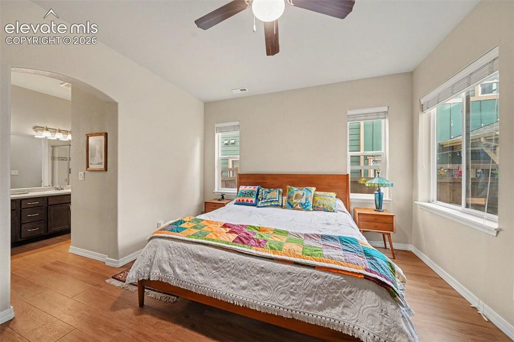 Image 12 of 26: Large primary bedroom and bathroom allowing for main level living