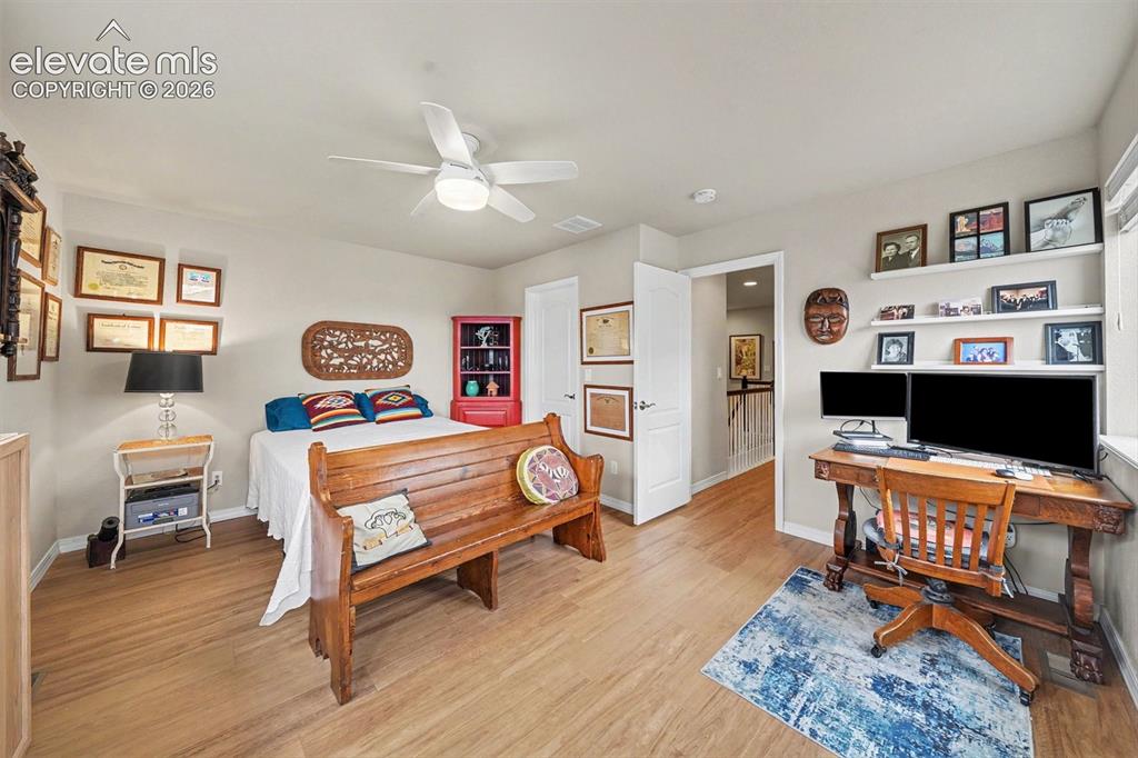 Image 19 of 26: Spacious upper level bedroom with walk in closet, large windows and easy to
