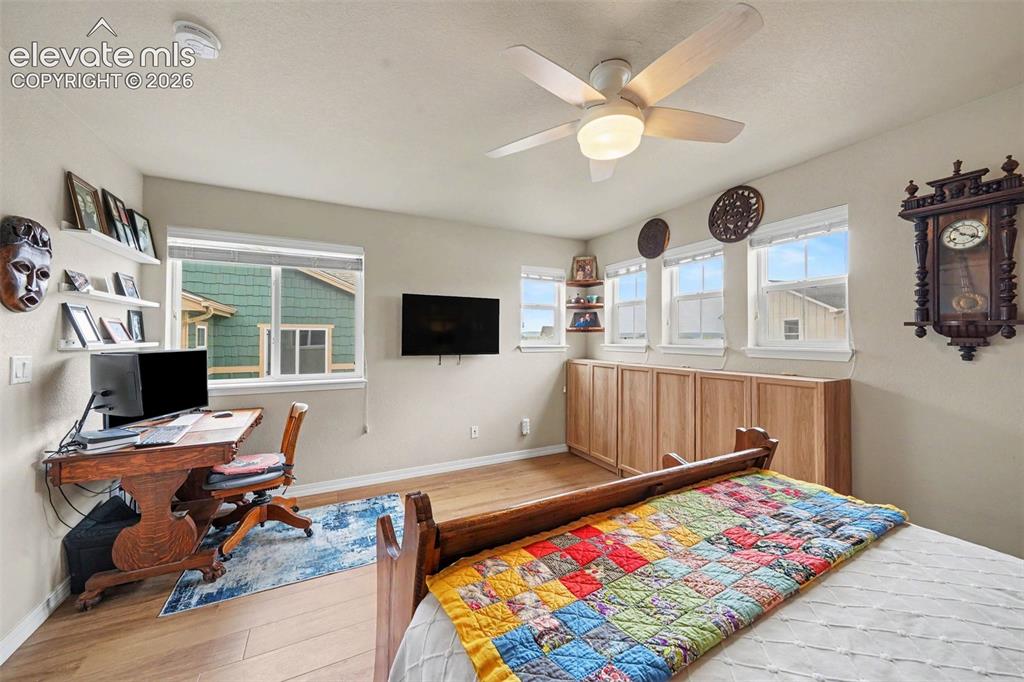 Image 20 of 26: Sunny and bright upper level bedroom 