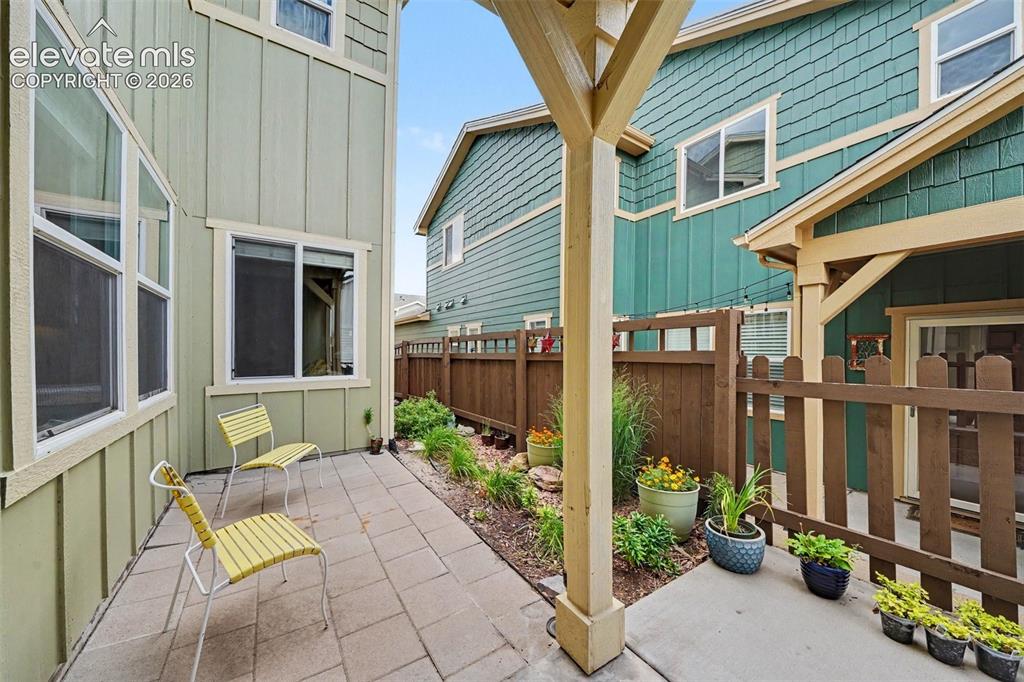 Image 3 of 26: Patio outside front door where one can enjoy the Colorado weather with a cu