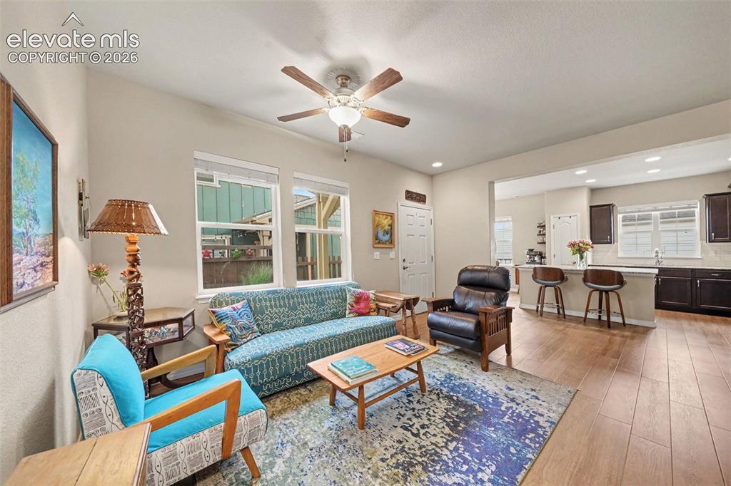 Image 4 of 26: Light bright entry into living area featuring beautiful plank flooring