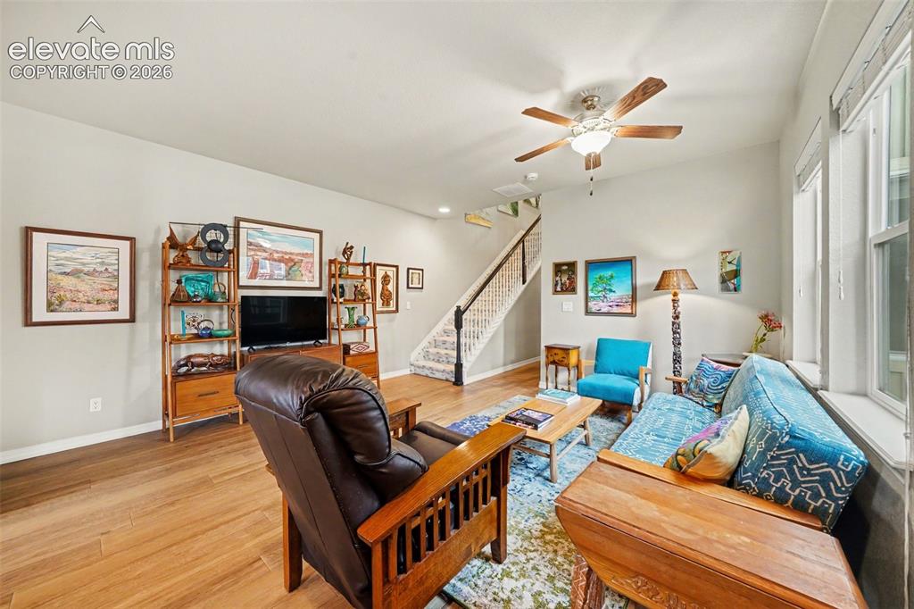 Image 5 of 26: View of living area from front door displaying spacious place to enjoy a mo