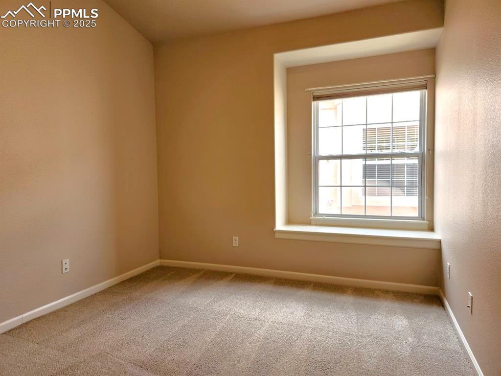 Image 17 of 34: Carpeted spare room with baseboards